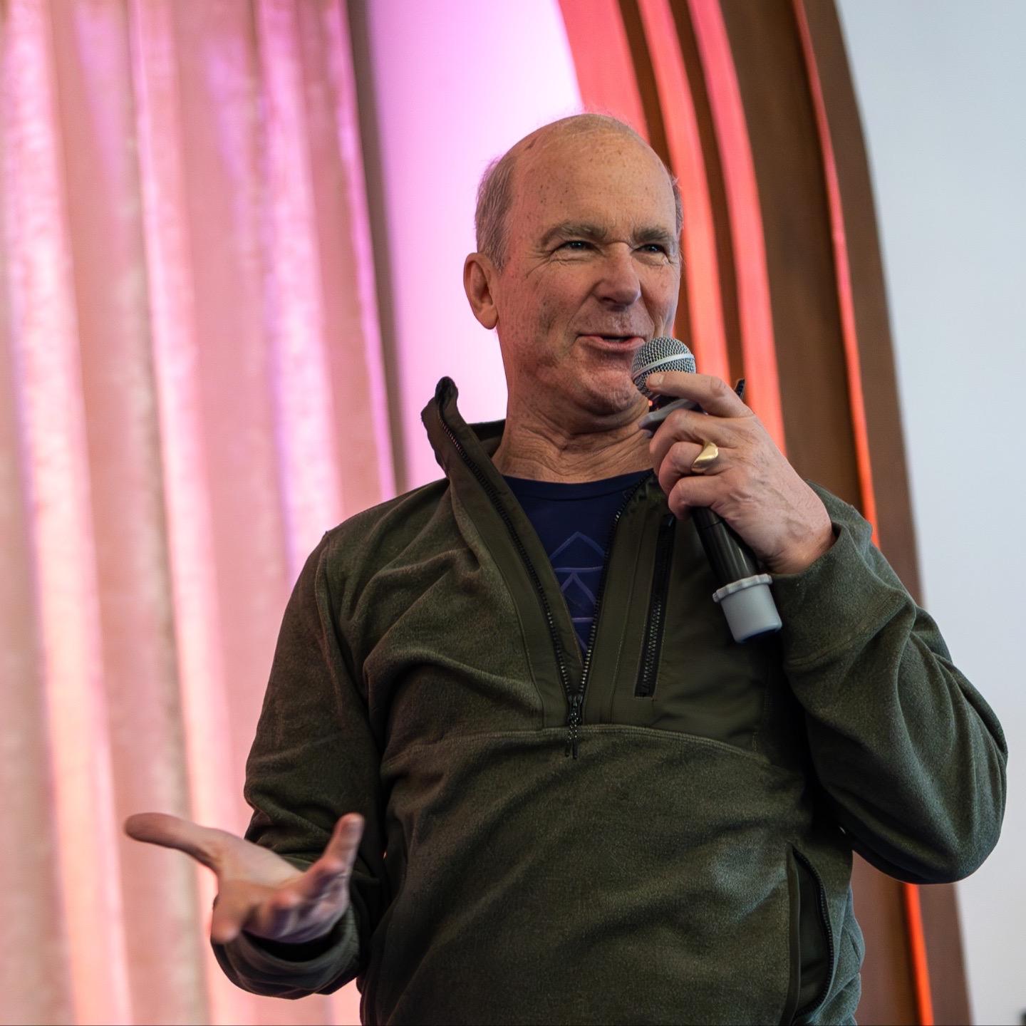 A participant sharing into the circle with a microphone